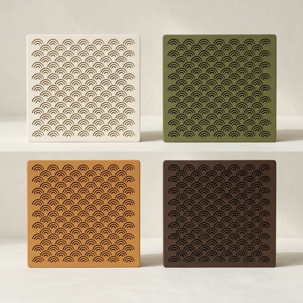 Arches doorbell chime covers in white, green, caramel and dark brown, showing the stacked-arch pattern