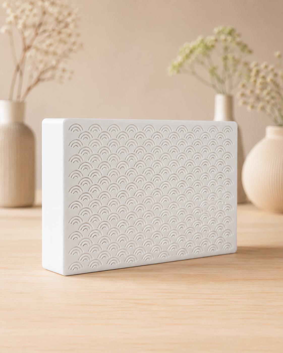 Arches doorbell chime cover at an angle, showing the stacked-arch pattern and box depth