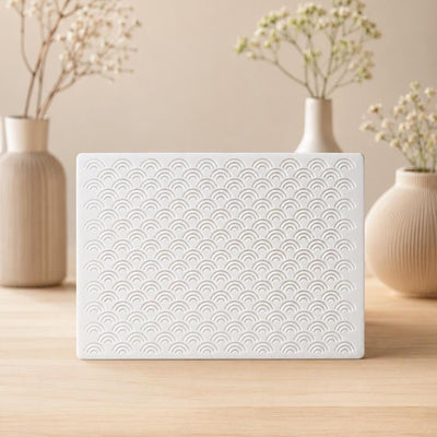 White Arches doorbell chime cover on wood, stacked-arch pattern — Iledecor