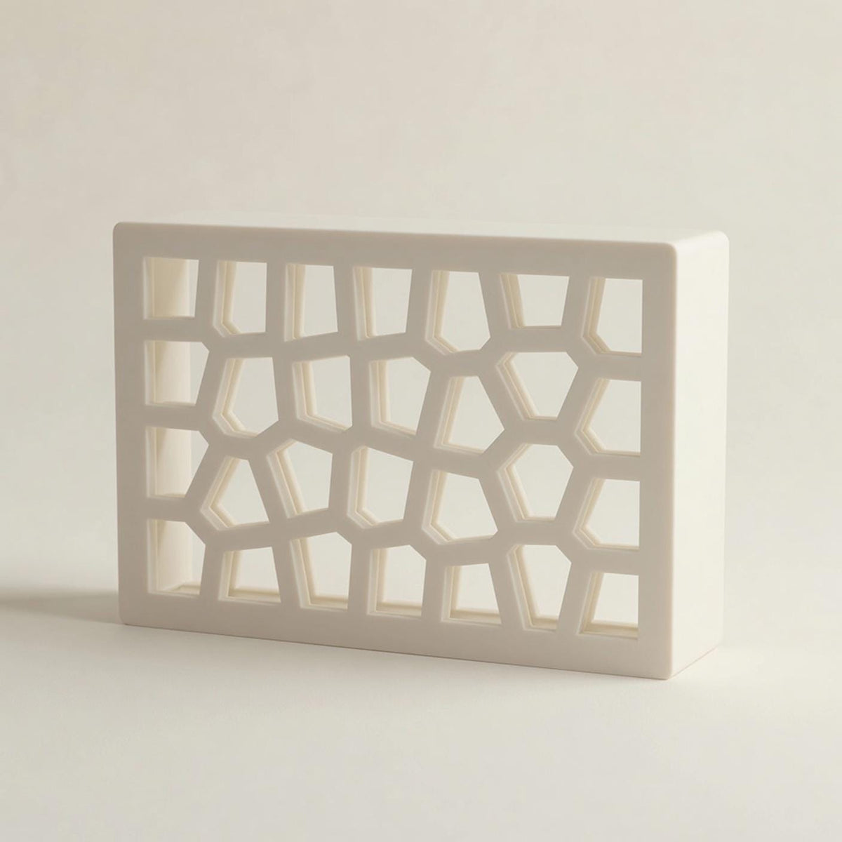 White Voronoi doorbell chime cover at an angle, cell lattice — Iledecor