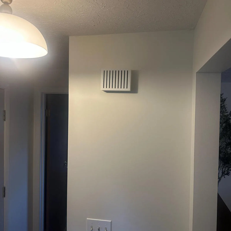 White Louver chime cover high on a hallway wall