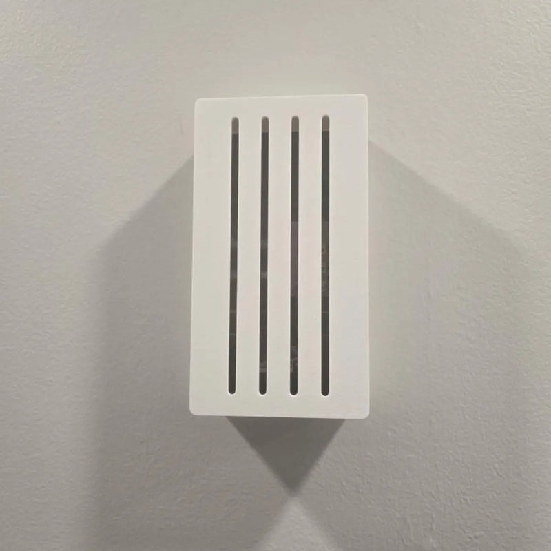 White Louver chime cover mounted in portrait orientation on a wall